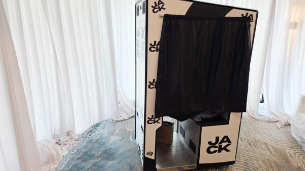 funstop photo booth with custom branding for a Tron arcade 80's theme