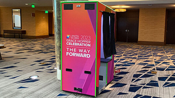 funstop photo booth with custom branding for a Tron arcade 80's theme